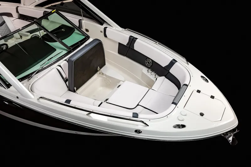 Slide: The Image of 2025 Chaparral 280 OSX boat interior with sleek white seating and modern design. - 43
