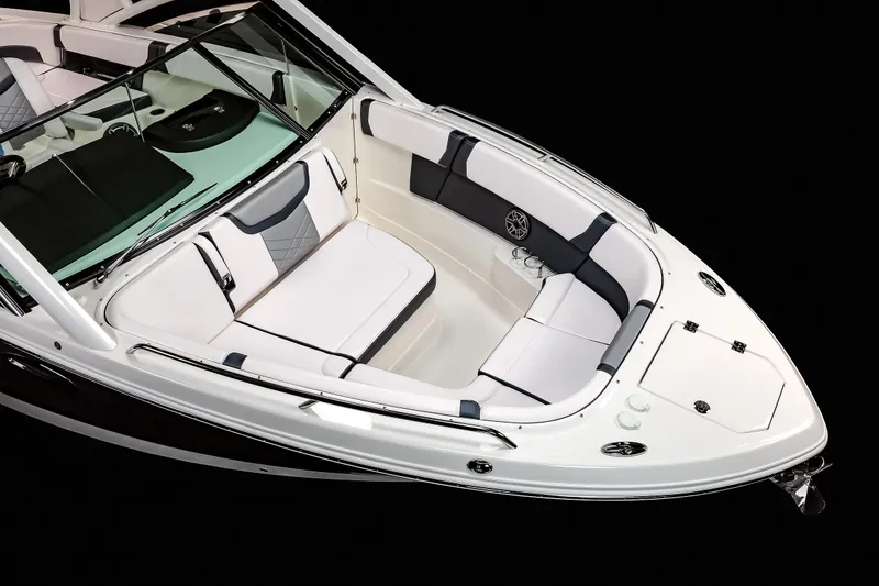 Slide: The Image of 2025 Chaparral 280 OSX boat interior with sleek white seating and modern design. - 44