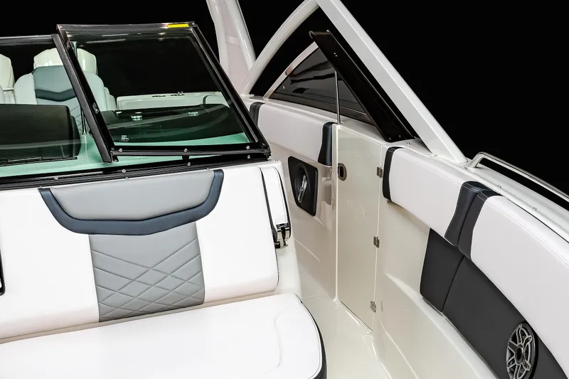 Slide: The Image of 2025 Chaparral 280 OSX boat interior with sleek seating and modern design elements. - 46