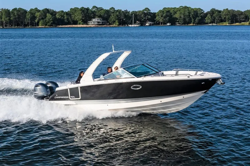 Slide: The Image of 2025 Chaparral 280 OSX boat cruising on a lake with passengers onboard. - 5