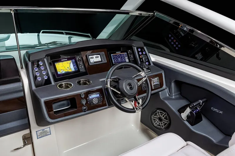 Slide: The Image of 2025 Chaparral 280 OSX boat dashboard with modern controls and navigation displays. - 9