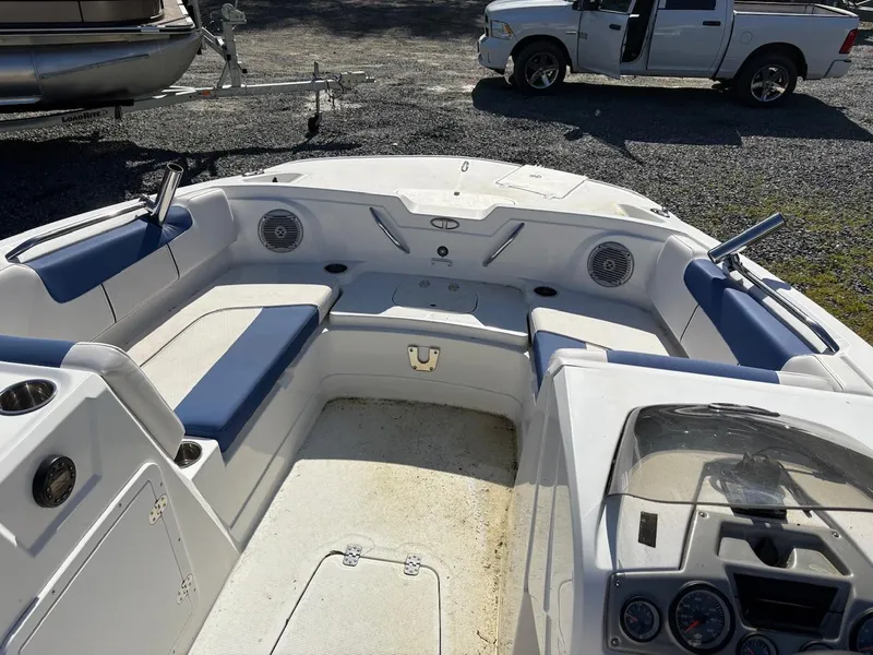 Slide: The Image of Interior of a 2020 Tahoe 1950 boat with blue and white seating. - 5