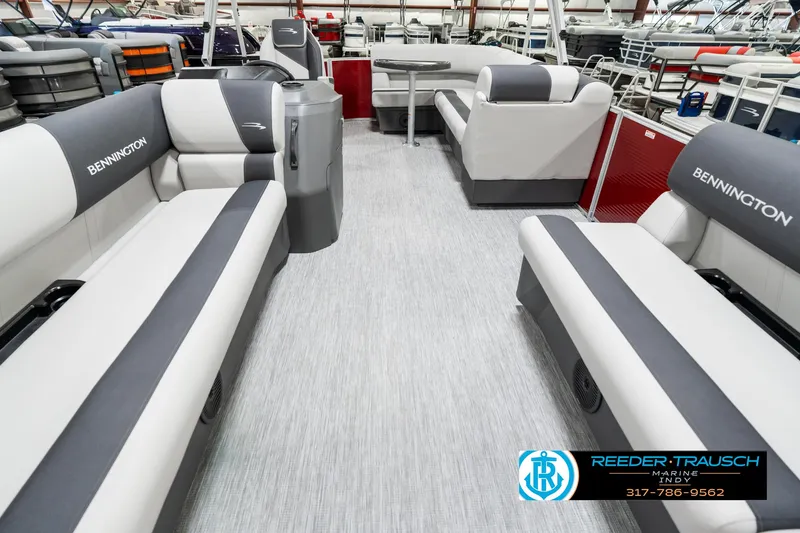 Slide: The Image of 2025 Bennington 20 SL pontoon boat interior with gray and white seating. - 16
