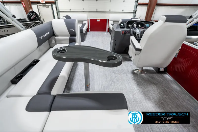 Slide: The Image of Interior of 2025 Bennington 20 SL pontoon boat with modern seating and steering console. - 19
