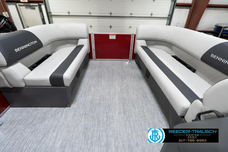 Slide: The Image of 2025 Bennington 20 SL interior with gray seating and flooring, showcasing spacious design. - 21