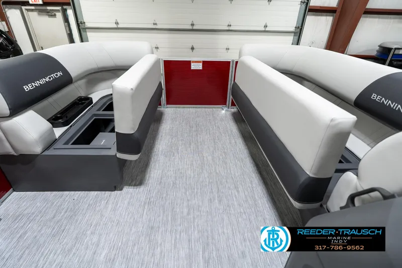 Slide: The Image of 2025 Bennington 20 SL pontoon boat interior with gray seating and storage compartments. - 22