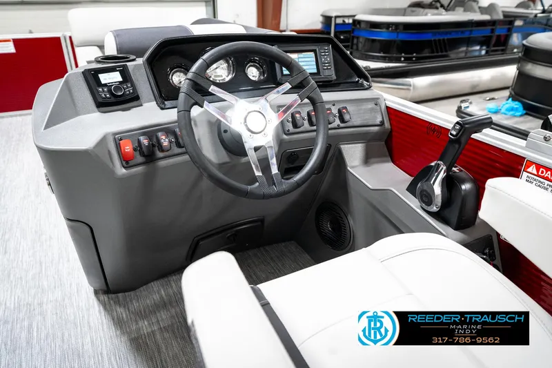 Slide: The Image of 2025 Bennington 20 SL boat dashboard with steering wheel and control panel. - 31