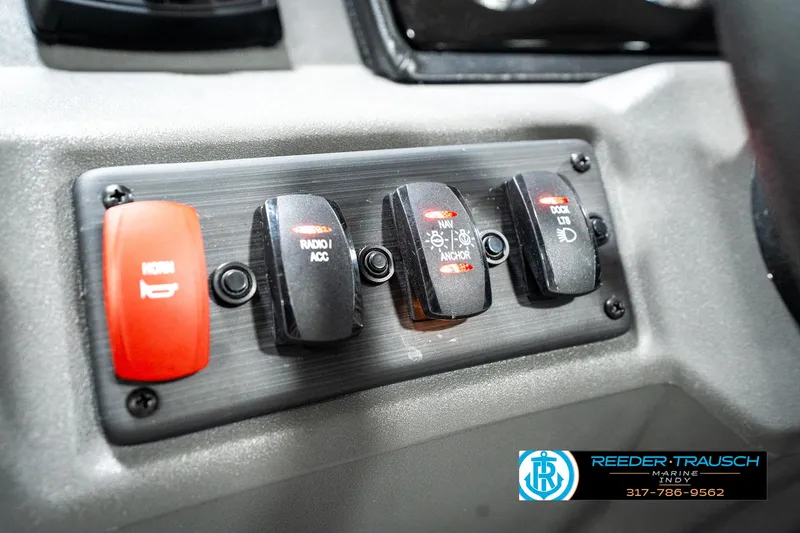 Slide: The Image of Control panel of a 2025 Bennington 20 SL boat with labeled switches. - 33