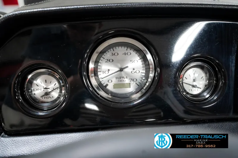 Slide: The Image of Dashboard gauges of a 2025 Bennington 20 SL boat, featuring RPM and trim indicators. - 35
