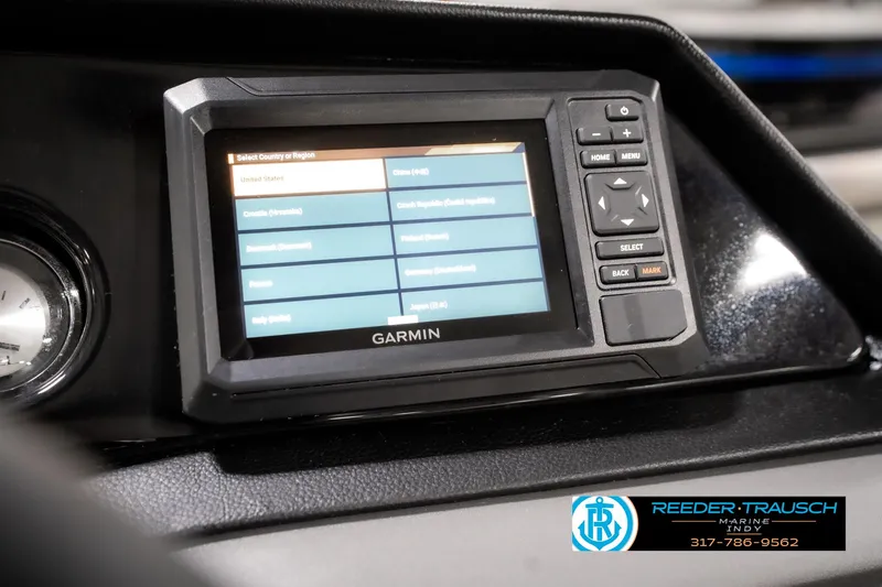 Slide: The Image of Garmin display on 2025 Bennington 20 SL boat dashboard, featuring navigation controls. - 36