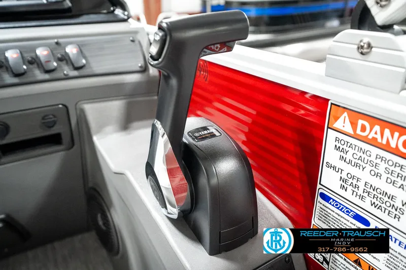 Slide: The Image of Throttle control of 2025 Bennington 20 SL boat with warning labels and dashboard details. - 38