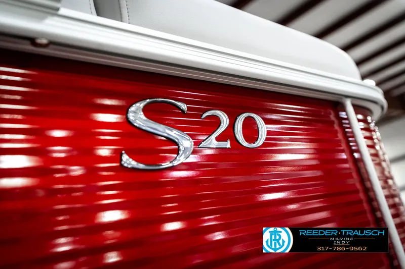 Slide: The Image of 2025 Bennington 20 SL boat with red exterior and S20 emblem. - 47
