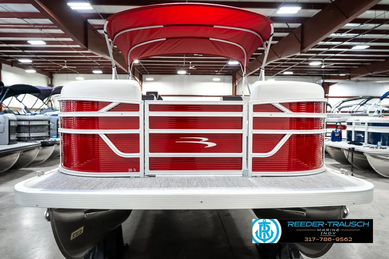 Slide: The Image of 2025 Bennington 20 SL pontoon boat with red exterior in showroom. - 5