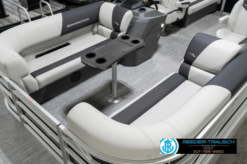 Slide: The Image of 2025 Bennington 20 SSR pontoon boat interior with plush seating and table. - 13
