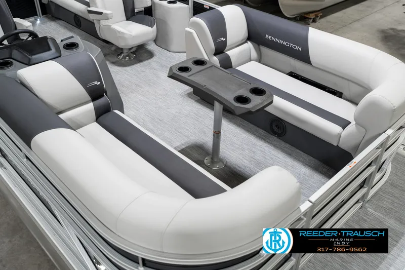 Slide: The Image of 2025 Bennington 20 SSR pontoon boat interior with plush seating and table. - 14