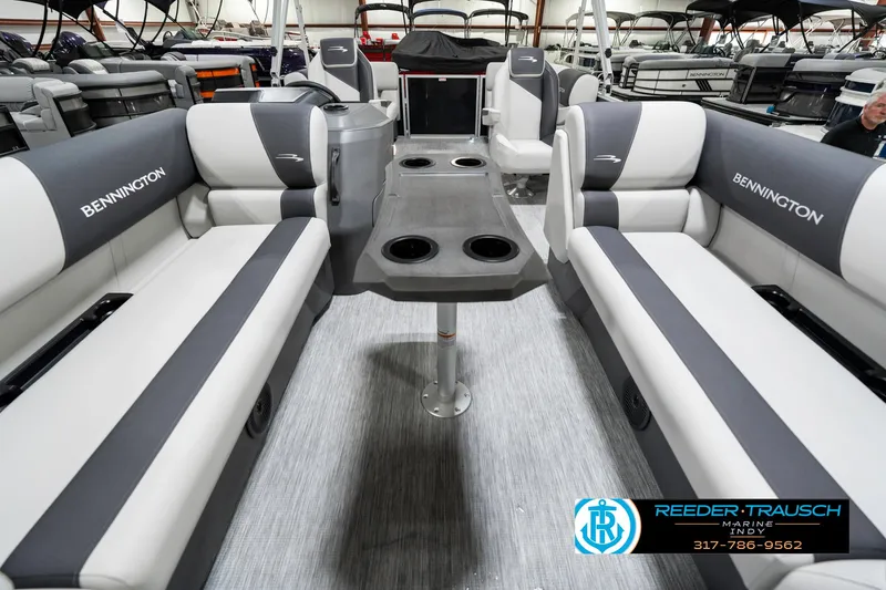 Slide: The Image of 2025 Bennington 20 SSR pontoon boat interior with gray seating and central table. - 17