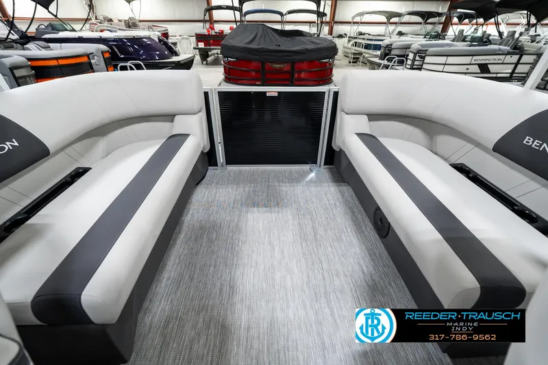 Slide: The Image of 2025 Bennington 20 SSR pontoon boat interior with gray seating and carpet flooring. - 19