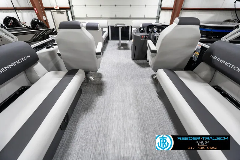 Slide: The Image of 2025 Bennington 20 SSR boat interior with gray seating and modern dashboard. - 20