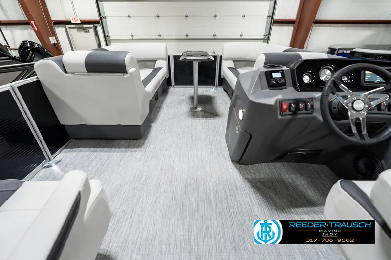 Slide: The Image of 2025 Bennington 20 SSR pontoon boat interior with modern seating and sleek dashboard design. - 21