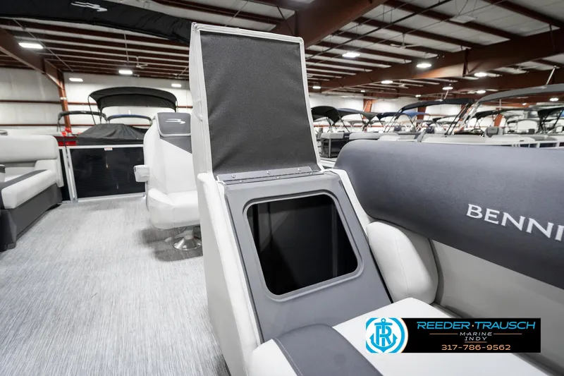 Slide: The Image of 2025 Bennington 20 SSR boat interior with open storage compartment, showroom setting. - 26