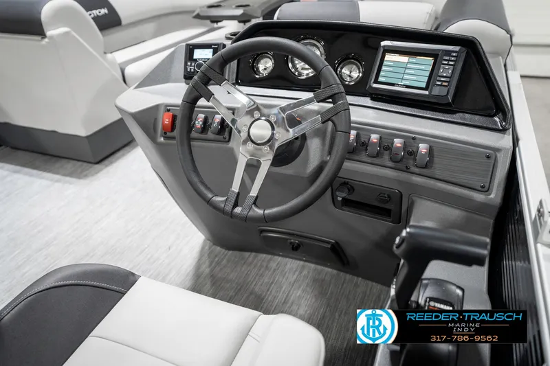 Slide: The Image of 2025 Bennington 20 SSR boat dashboard with steering wheel and control panel. - 29