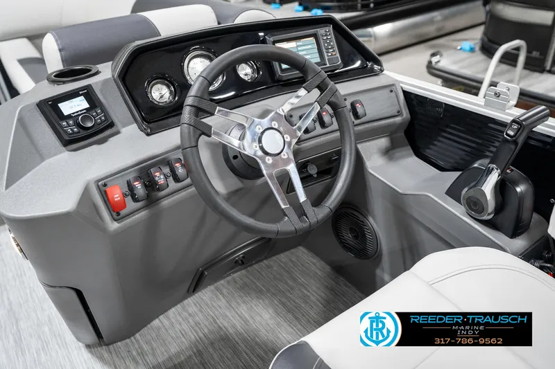 Slide: The Image of 2025 Bennington 20 SSR boat dashboard with steering wheel and control panel. - 30