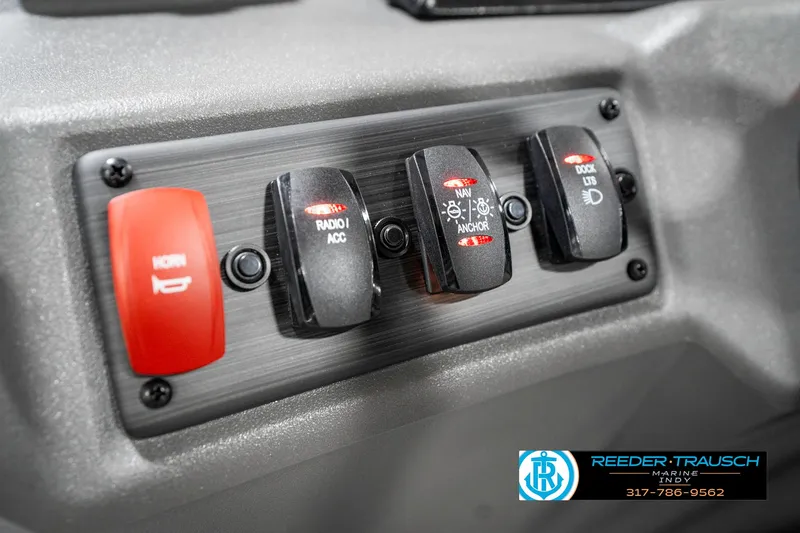 Slide: The Image of Control panel of 2025 Bennington 20 SSR boat with labeled switches. - 32