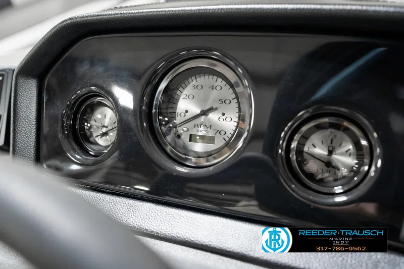 Slide: The Image of Dashboard gauges of a 2025 Bennington 20 SSR boat, featuring RPM and other indicators. - 34