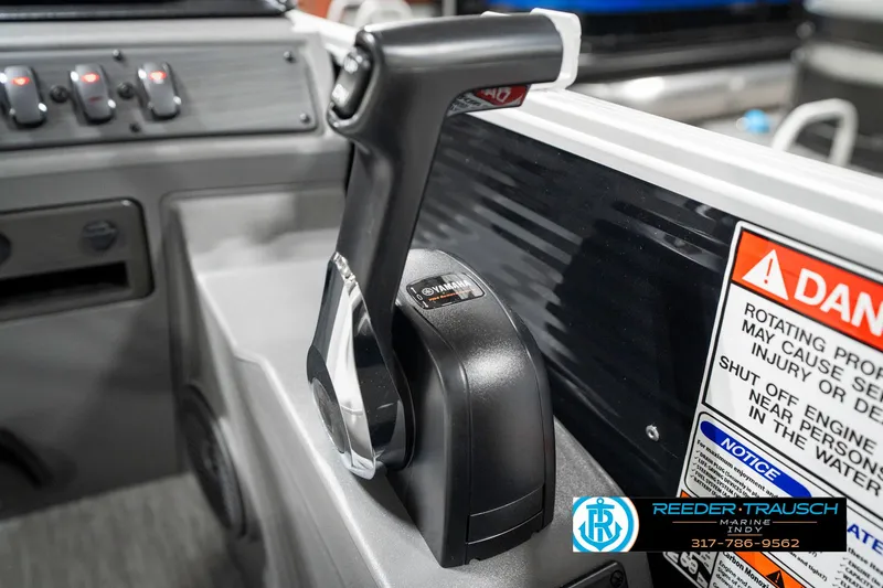 Slide: The Image of Throttle control of a 2025 Bennington 20 SSR boat, featuring safety warnings and control panel. - 37
