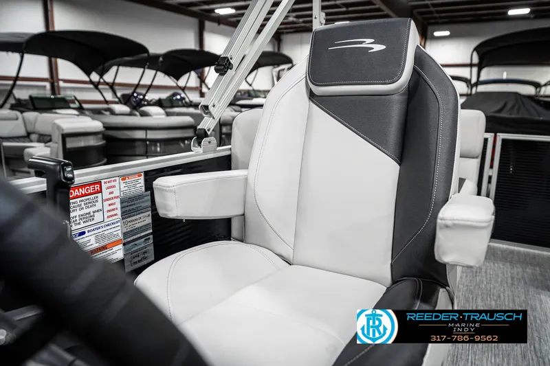 Slide: The Image of 2025 Bennington 20 SSR boat seat in showroom, featuring sleek design and comfortable upholstery. - 38