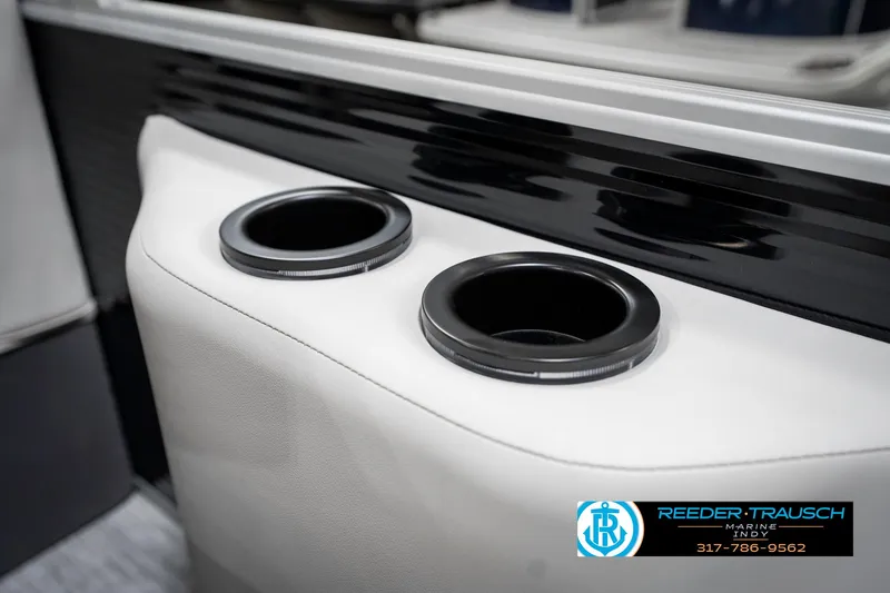 Slide: The Image of Cup holders on a 2025 Bennington 20 SSR boat, featuring sleek white and black design. - 45