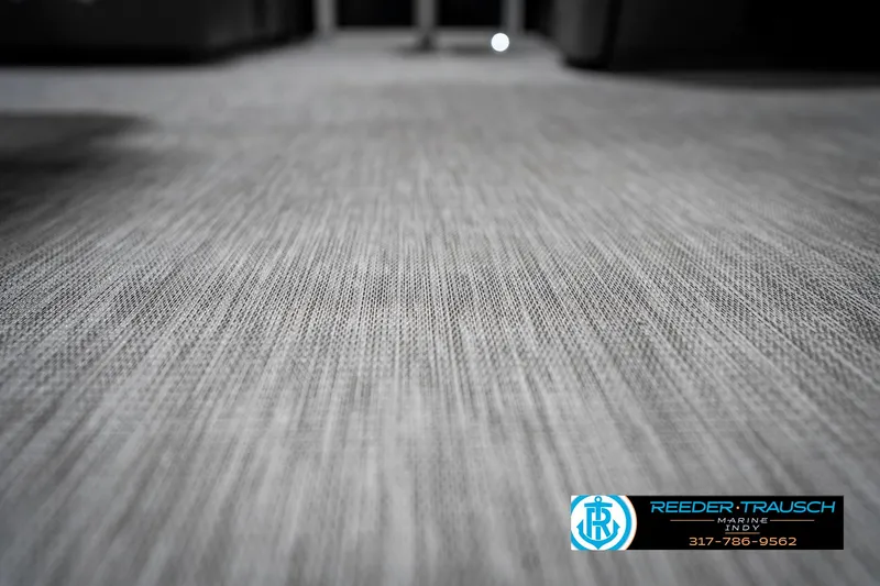 Slide: The Image of 2025 Bennington 20 SSR interior flooring with textured gray surface. - 46