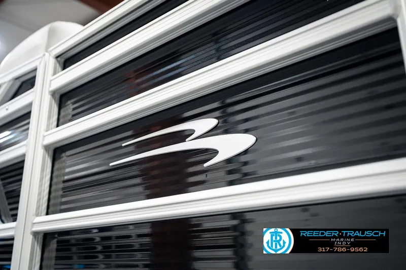 Slide: The Image of 2025 Bennington 20 SSR boat detail with logo and Reeder-Trausch Marine branding. - 47