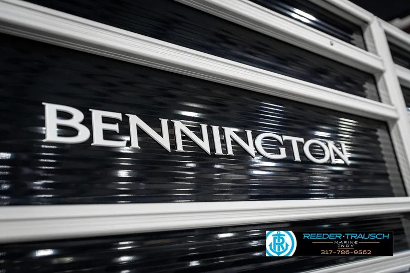 Slide: The Image of 2025 Bennington 20 SSR boat logo with sleek black and white design. - 48