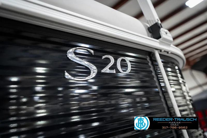 Slide: The Image of 2025 Bennington 20 SSR boat with "S 20" emblem, Reeder-Trausch Marine logo visible. - 49