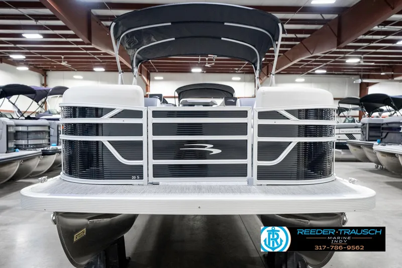 Slide: The Image of 2025 Bennington 20 SSR pontoon boat in showroom, front view. - 6