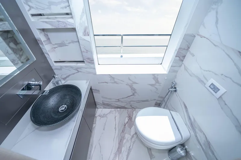 Slide: The Image of Luxurious bathroom in 2024 Nomad 75 SUV with marble walls and modern fixtures. - 24