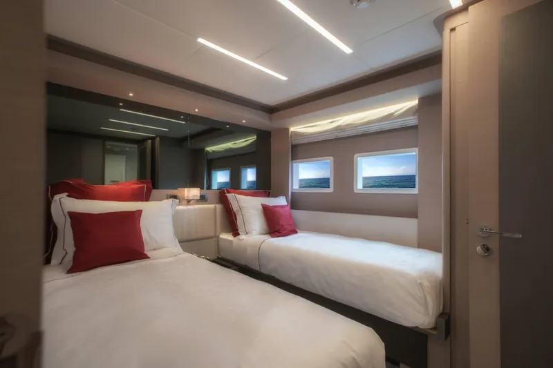 Slide: The Image of Luxurious bedroom interior of 2024 Nomad 75 SUV yacht with twin beds and elegant decor. - 37