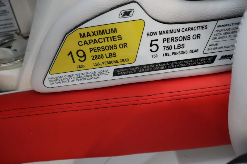 Slide: The Image of Capacity label on 2018 Nautique Super Air Nautique G25 boat, showing limits. - 13