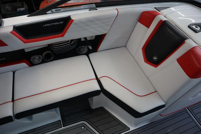 Slide: The Image of 2018 Nautique Super Air Nautique G25 interior with red and white seating, modern design. - 14