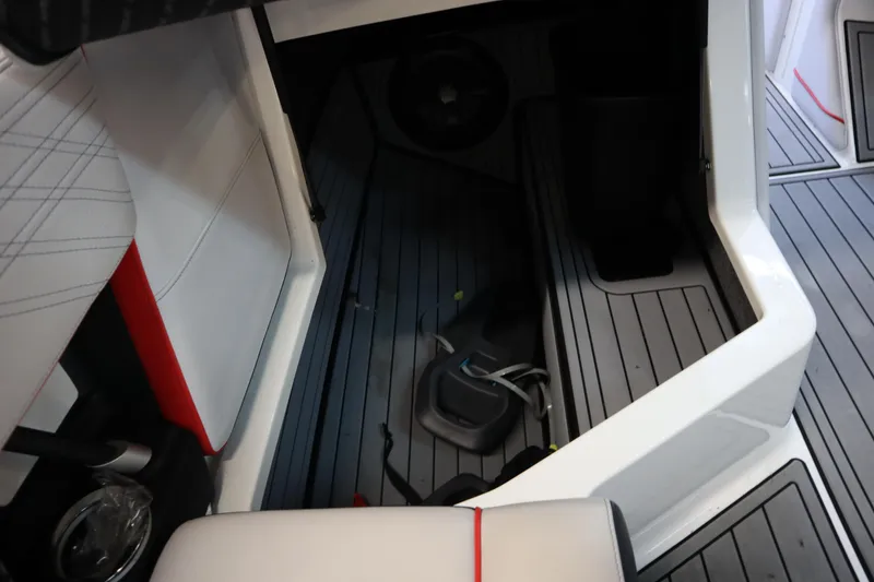 Slide: The Image of Interior view of 2018 Nautique Super Air Nautique G25 boat, featuring sleek seating and flooring. - 15