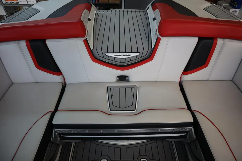 Slide: The Image of 2018 Nautique Super Air Nautique G25 interior with red and gray seating. - 20