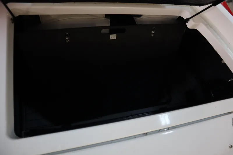 Slide: The Image of Open storage compartment of 2018 Nautique Super Air Nautique G25 boat. - 22