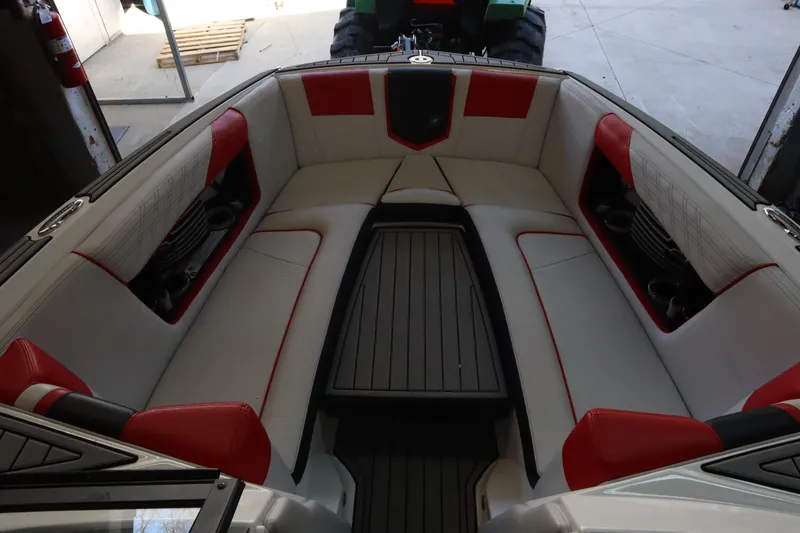 Slide: The Image of 2018 Nautique Super Air Nautique G25 interior with red and white seating. - 5