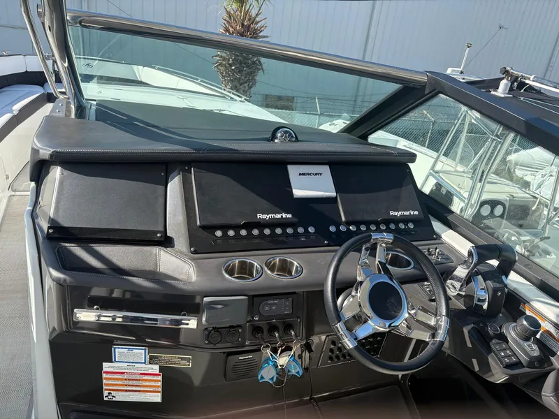 Slide: The Image of Cockpit of 2022 Monterey 385 Super Express with advanced navigation systems and sleek design. - 1