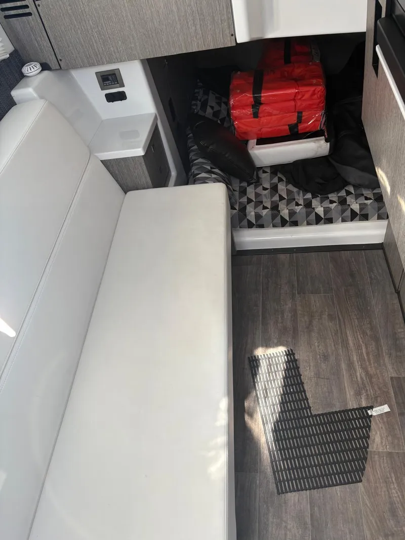 Slide: The Image of Interior of 2022 Monterey 385 Super Express with white seating and modern flooring. - 12