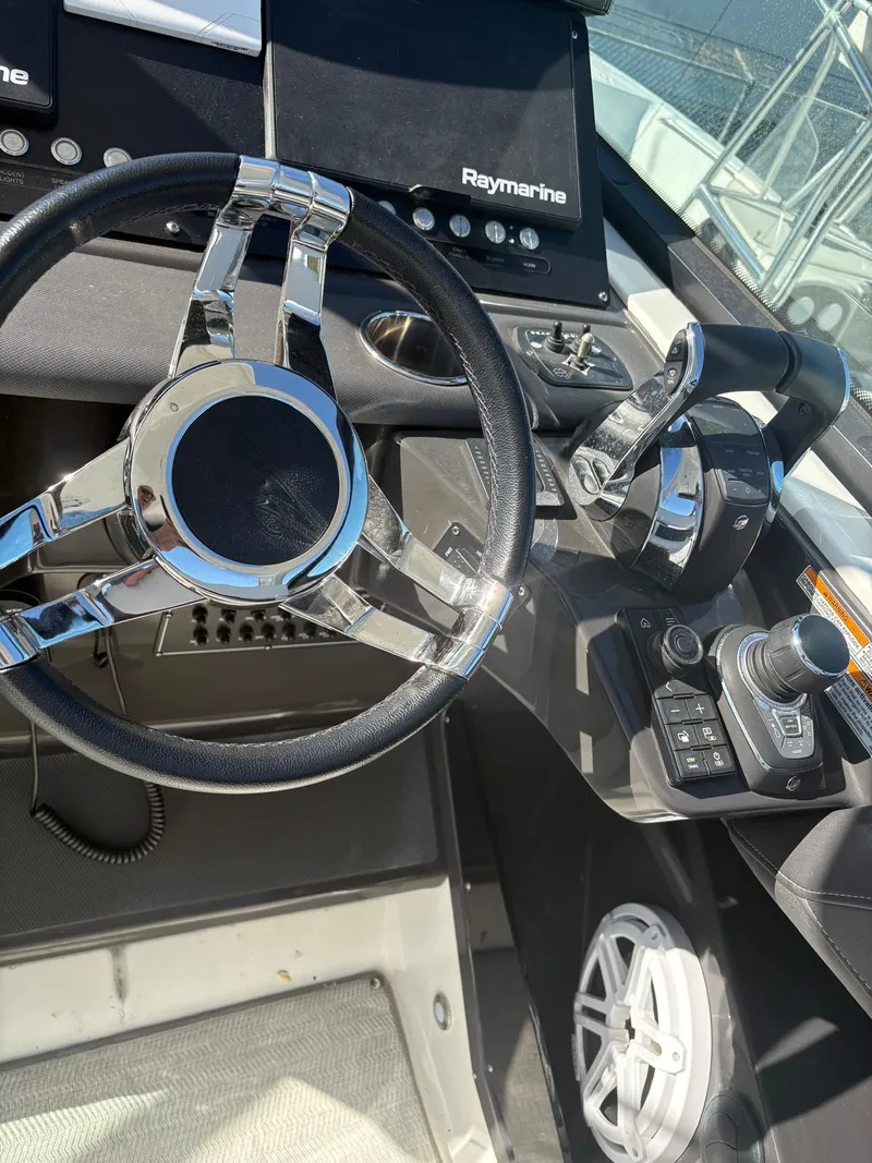 Slide: The Image of 2022 Monterey 385 Super Express helm with steering wheel and control panel. - 21