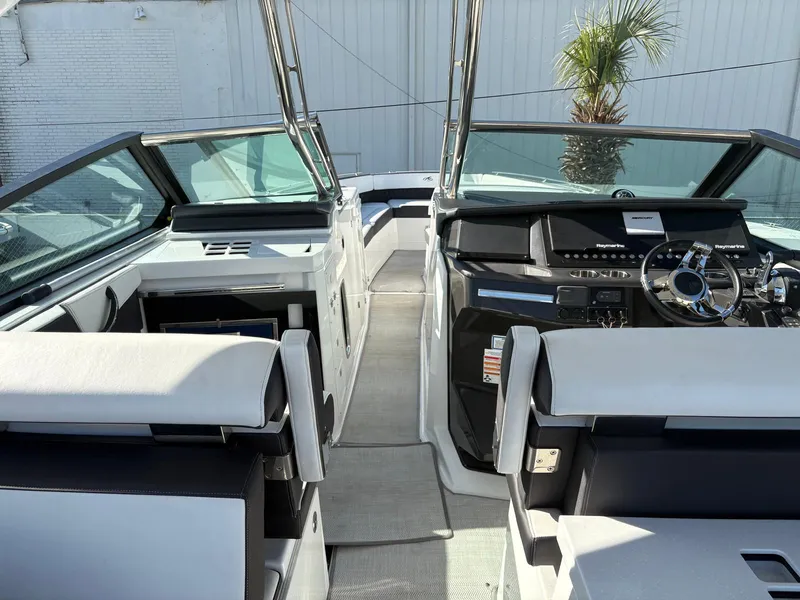 Slide: The Image of 2022 Monterey 385 Super Express boat interior with modern dashboard and seating. - 23
