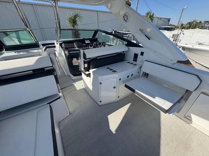 Slide: The Image of 2022 Monterey 385 Super Express yacht interior with sleek seating and modern design. - 26