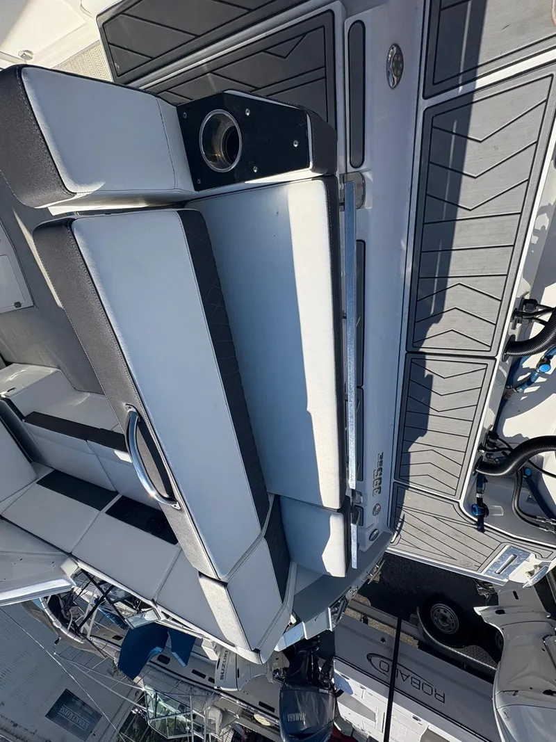 Slide: The Image of 2022 Monterey 385 Super Express boat interior with sleek seating and modern design. - 27